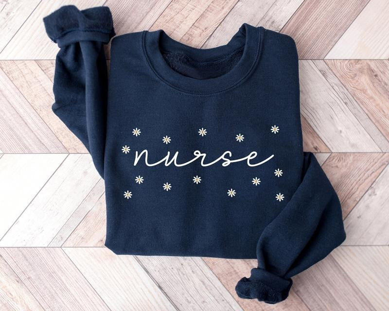 Daisy Nurse RN ER Sweatshirt, Floral Nurse Shirt, Nurse Sweater, Nursing Crewneck, BSN RN ER Graduation Gift For New...