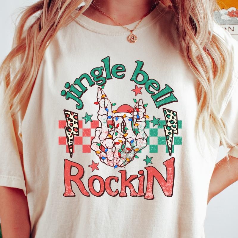 JINGLE BELL ROCKIN SKELETON T-SHIRT (COMFORT COLORS T-SHIRT, CASUAL SHIRT UNISEX, CHRISTMAS CLOTHING, GRAPHIC APPAREL,...